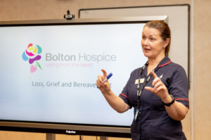 Bolton Hospice staff member giving a presentation during the years of our previous partnership, before the MCF bursaries scheme