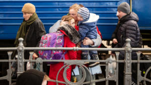 Ukrainian families at Kyiv railway station on their way to the UK