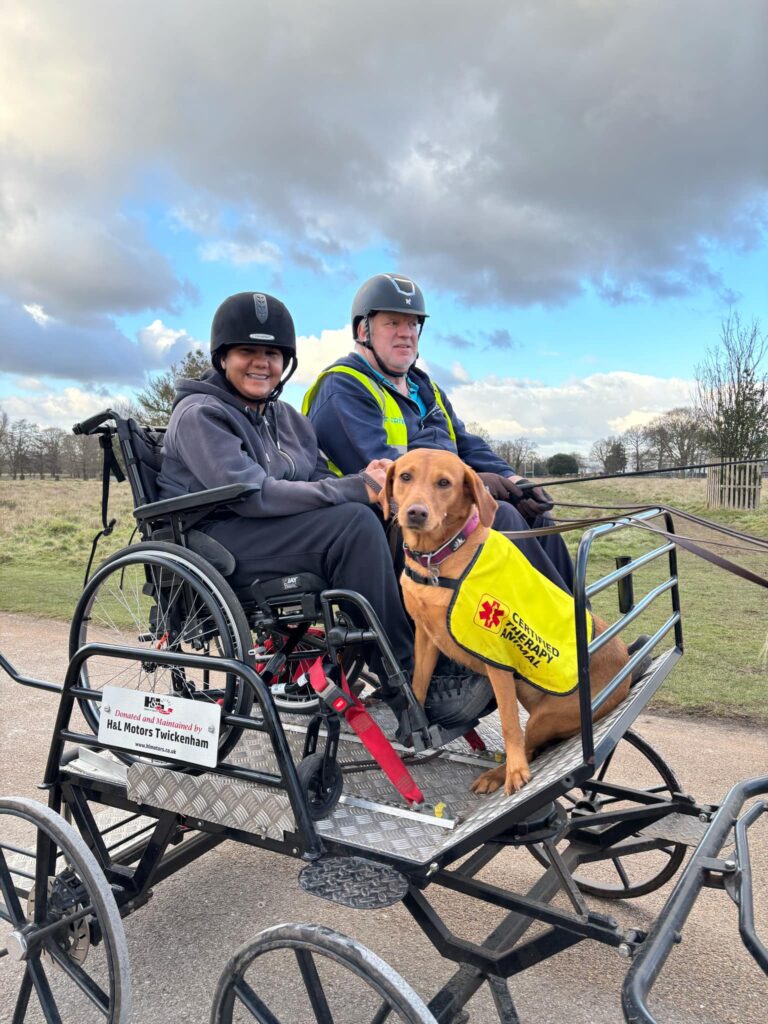 Lauryn with her carriage driving coach Peter